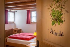 A bed or beds in a room at Agriturismo Maso Santa Libera