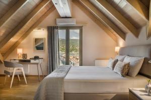Posteľ alebo postele v izbe v ubytovaní Grand View Maisonette
