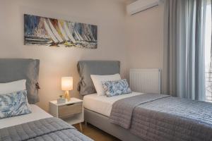 Posteľ alebo postele v izbe v ubytovaní Grand View Maisonette