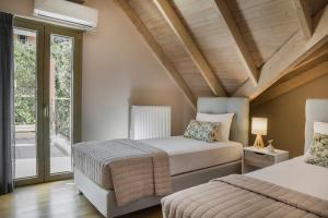 Posteľ alebo postele v izbe v ubytovaní Grand View Maisonette
