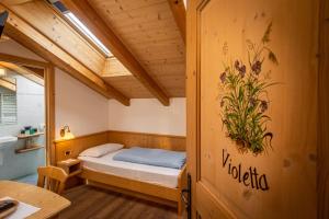 A bed or beds in a room at Agriturismo Maso Santa Libera