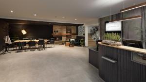 a dining room and living room with a dining table at Hotel VierJahreszeiten am Seilersee in Iserlohn