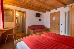 A bed or beds in a room at Agriturismo Maso Santa Libera
