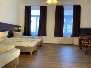 A bed or beds in a room at Ferienwohnungen Neumann