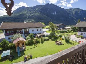 a view from a balcony of a house with a yard at Hörlhof - Chiemgau Karte in Inzell