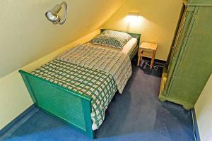 Ein Bett oder Betten in einem Zimmer der Unterkunft Ferienhaussiedlung Strandperlen Küstenhof 2c Typ V