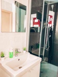 a bathroom with a sink, toilet and shower at Мини-отель Backpack in Kazan