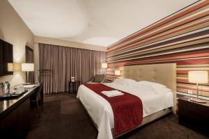 Giường trong phòng chung tại Hotel Trópico