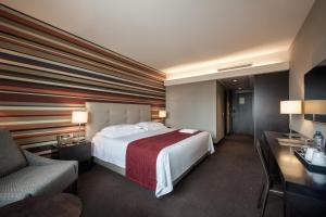 Giường trong phòng chung tại Hotel Trópico