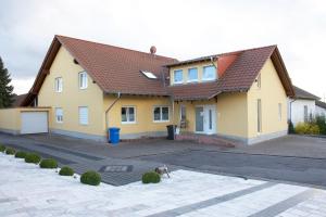 a dog standing in front of a house at Ferienwohnungen Beckingen in Beckingen
