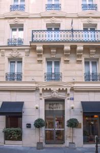 a large building with a large window on the side of it at Tilsitt Etoile in Paris