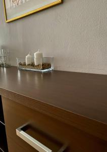 a wooden table topped with a cup of coffee at Hotel Akor in Bydgoszcz