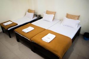 Postelja oz. postelje v sobi nastanitve Hotel Govindpuram