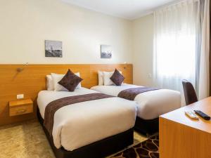 Кровать или кровати в номере Mercure Ismailia Forsan Island