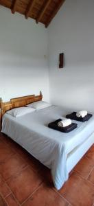 Postel nebo postele na pokoji v ubytování Casa da caldeira