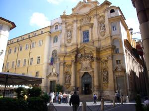 a large building with people walking in front of it at Pantheon Antique Suite in Rome