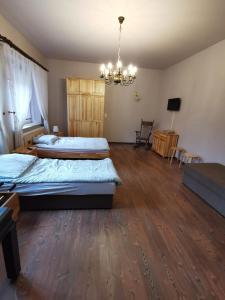 a bedroom with a bed and a desk at Apartament Rodzinny in Nowy Targ