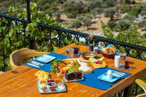 a wooden table with food on top at Elit Hotel Kas in Kaş