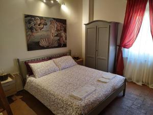 Postel nebo postele na pokoji v ubytování Appartamento I Pini