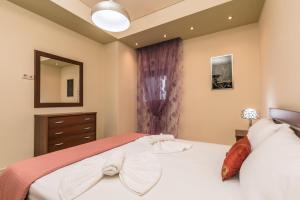 Posteľ alebo postele v izbe v ubytovaní Loridis View Apartments
