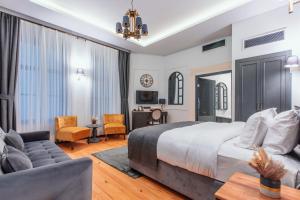 a bedroom with a king sized bed and a couch at Ferman Port Hotel - Special Category in Istanbul