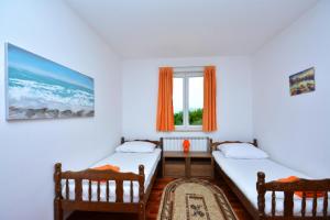 Postel nebo postele na pokoji v ubytování Holiday Home Nevenka + 20 fotografií