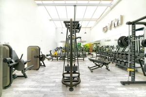 a gym with rows of treadmills and machines at Bull Eugenia Victoria & Spa in Playa del Ingles