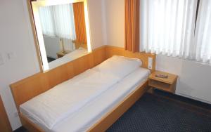 Postel nebo postele na pokoji v ubytování Hotel Victoria