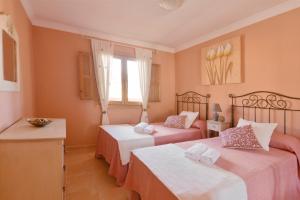 Łóżko lub łóżka w pokoju w obiekcie Vivienda Vacacional Radi