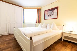 Postel nebo postele na pokoji v ubytování Biohotel Castello Königsleiten