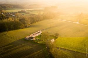 an aerial view of a bus in a field at La Brocherie in Magny-le-Désert