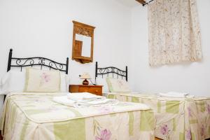 A bed or beds in a room at El Molinet del Governador- Apartamentos Rurales
