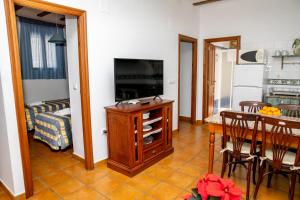 A kitchen or kitchenette at El Molinet del Governador- Apartamentos Rurales