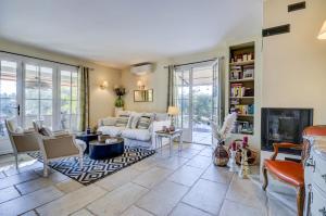 a living room with a couch and a fireplace at La Méridienne in Mouriès