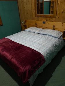 Postel nebo postele na pokoji v ubytování Hotel La Piccola Baita