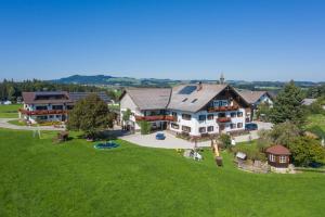 an aerial view of a large house on a green field at Bauernhofferien Oberdürnberg in Seekirchen am Wallersee