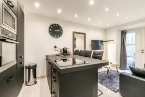 a kitchen with a sink and a counter top at Lac et Montagne in Veyrier-du-Lac