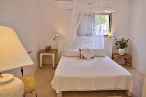 En eller flere senge i et værelse på Talaya Formentera