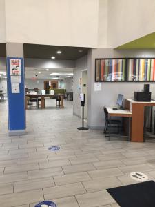 an empty lobby of an office with desks and tables at Holiday Inn Express & Suites Orangeburg, an IHG Hotel in Orangeburg