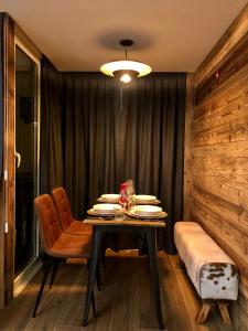 a dining room with a table and chairs at Central Apart Chalet in Breuil-Cervinia