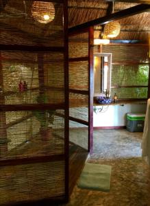 a view of a room with a cage in a room at AMACA Bacalar in Bacalar