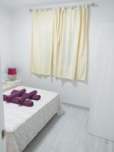Postel nebo postele na pokoji v ubytování CASA PARAISO