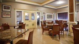 a dining room with tables and chairs in a restaurant at Best Western Williams Lake in Williams Lake