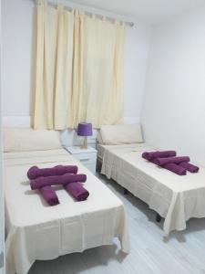Postel nebo postele na pokoji v ubytování CASA PARAISO