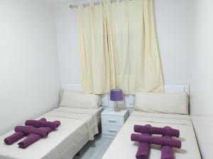 Postel nebo postele na pokoji v ubytování CASA PARAISO