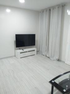TV a/nebo společenská místnost v ubytování CASA PARAISO