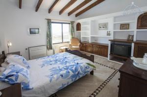 Łóżko lub łóżka w pokoju w obiekcie Villa Buen Lugar