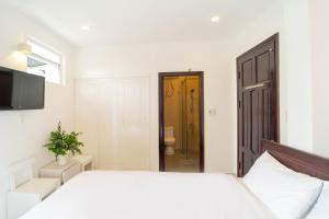 Postel nebo postele na pokoji v ubytování Xuan Cuong Hotel