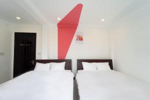 Postel nebo postele na pokoji v ubytování Xuan Cuong Hotel