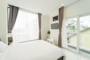 Postel nebo postele na pokoji v ubytování Xuan Cuong Hotel